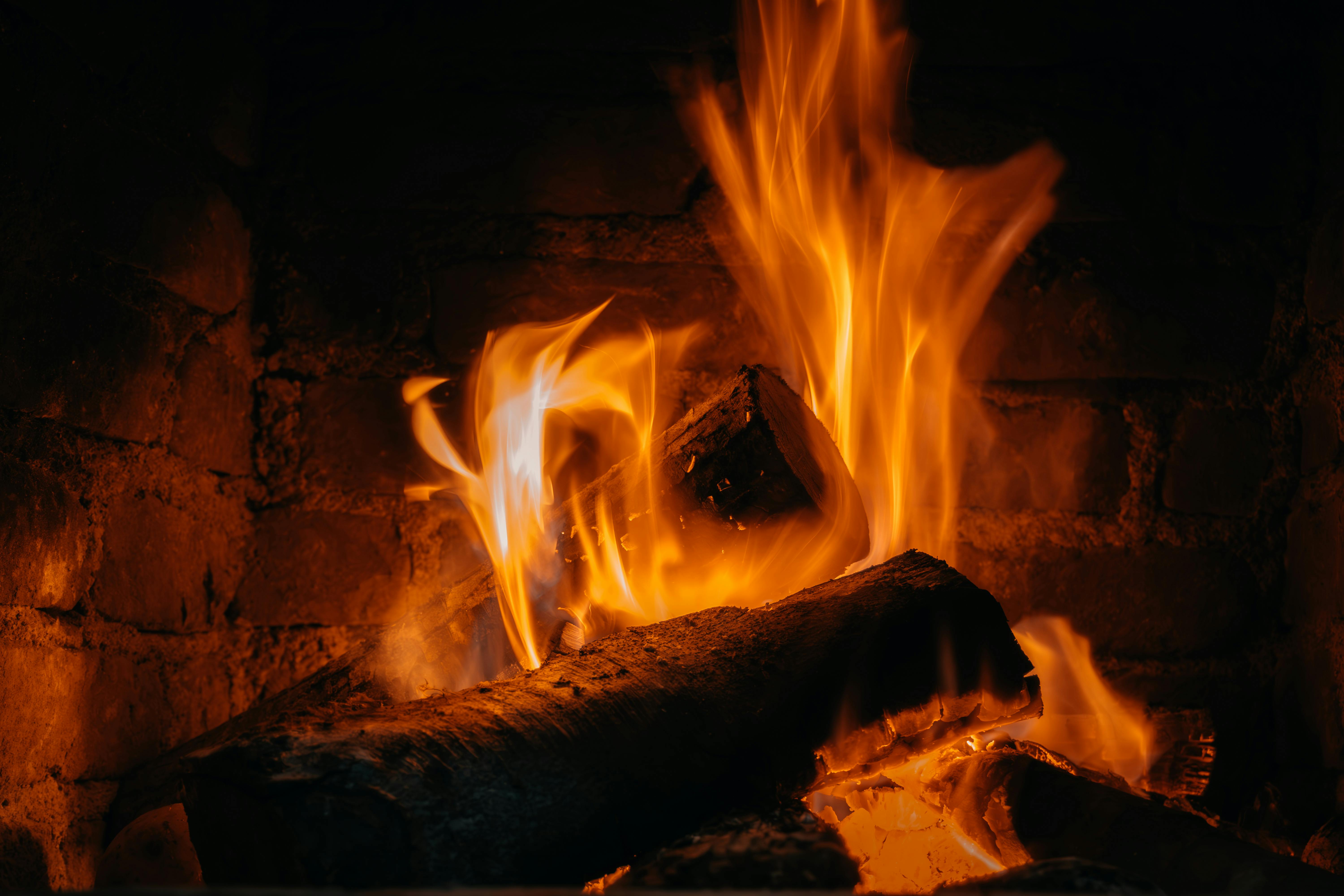 A wood-burning stove fire glowing